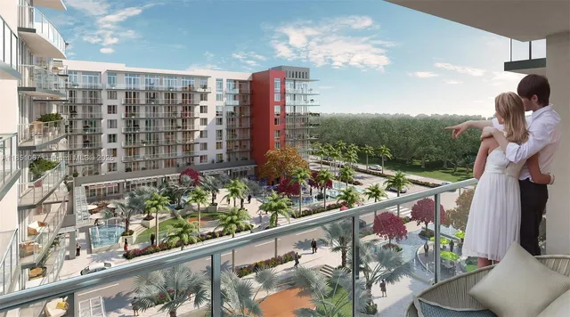 a city view from a balcony with outdoor seating