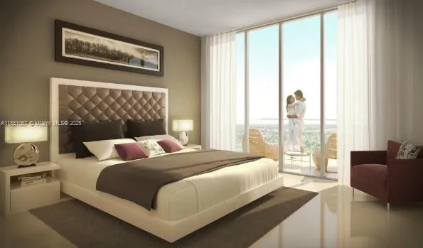 a bedroom with a large bed and a couch