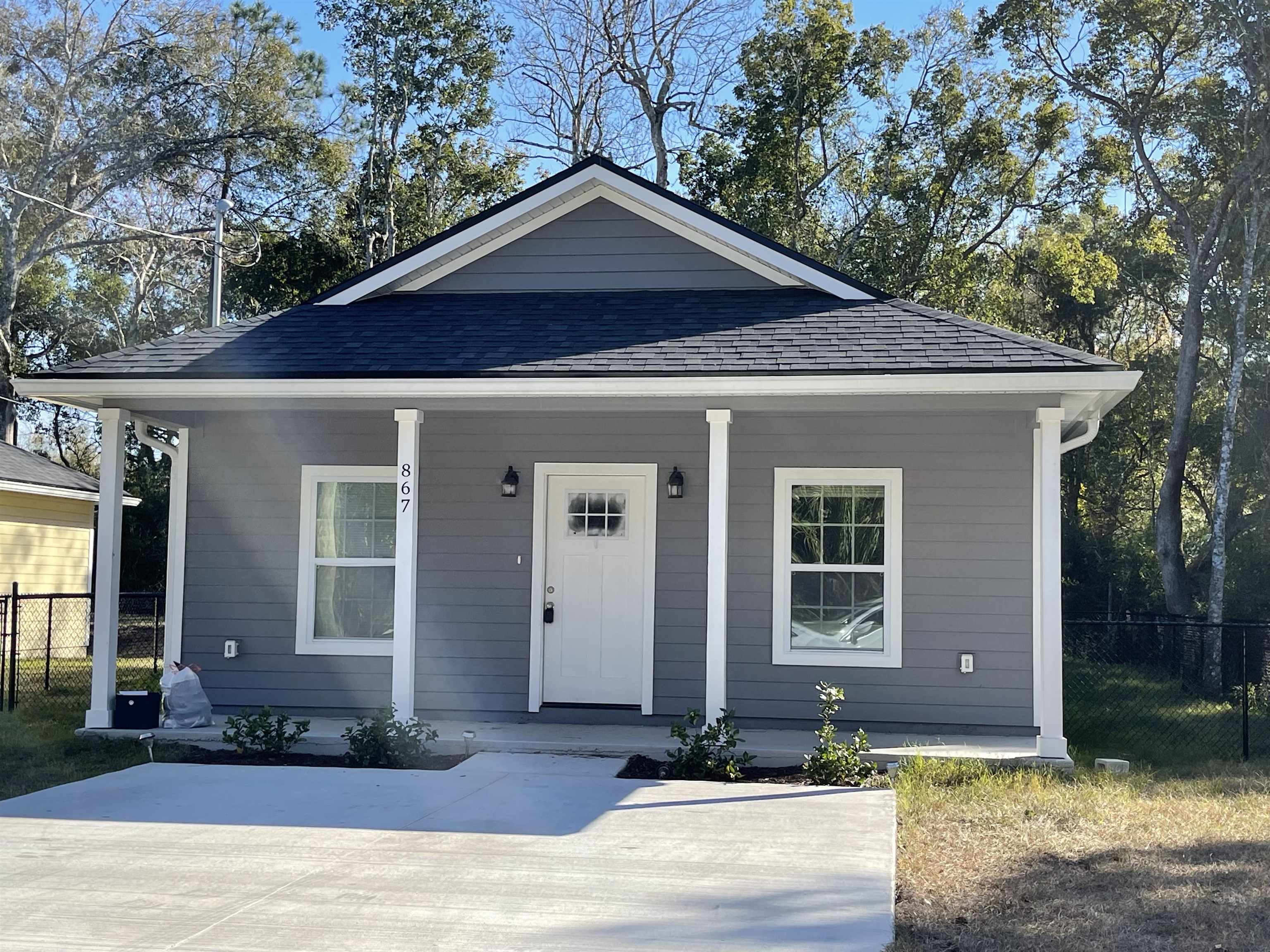 867 Helen Street St. Augustine, FL 32084 - Photo 11 of 11 a front view of a house with garden