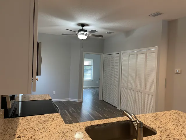 a view of a livingroom with furniture and chandelier