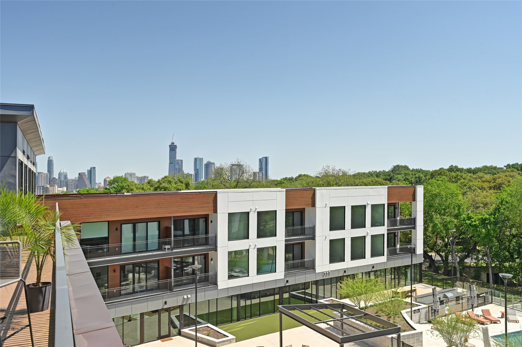 2209 South 1st Street, Unit 408 Austin, TX 78704 - Photo 9 of 28 a view of a large building with a yard