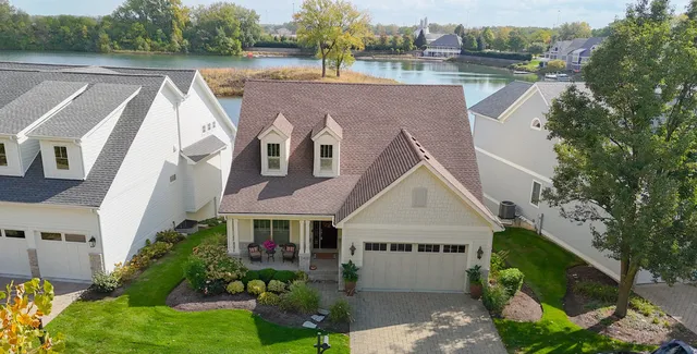 a view of house with outdoor space and sitting area