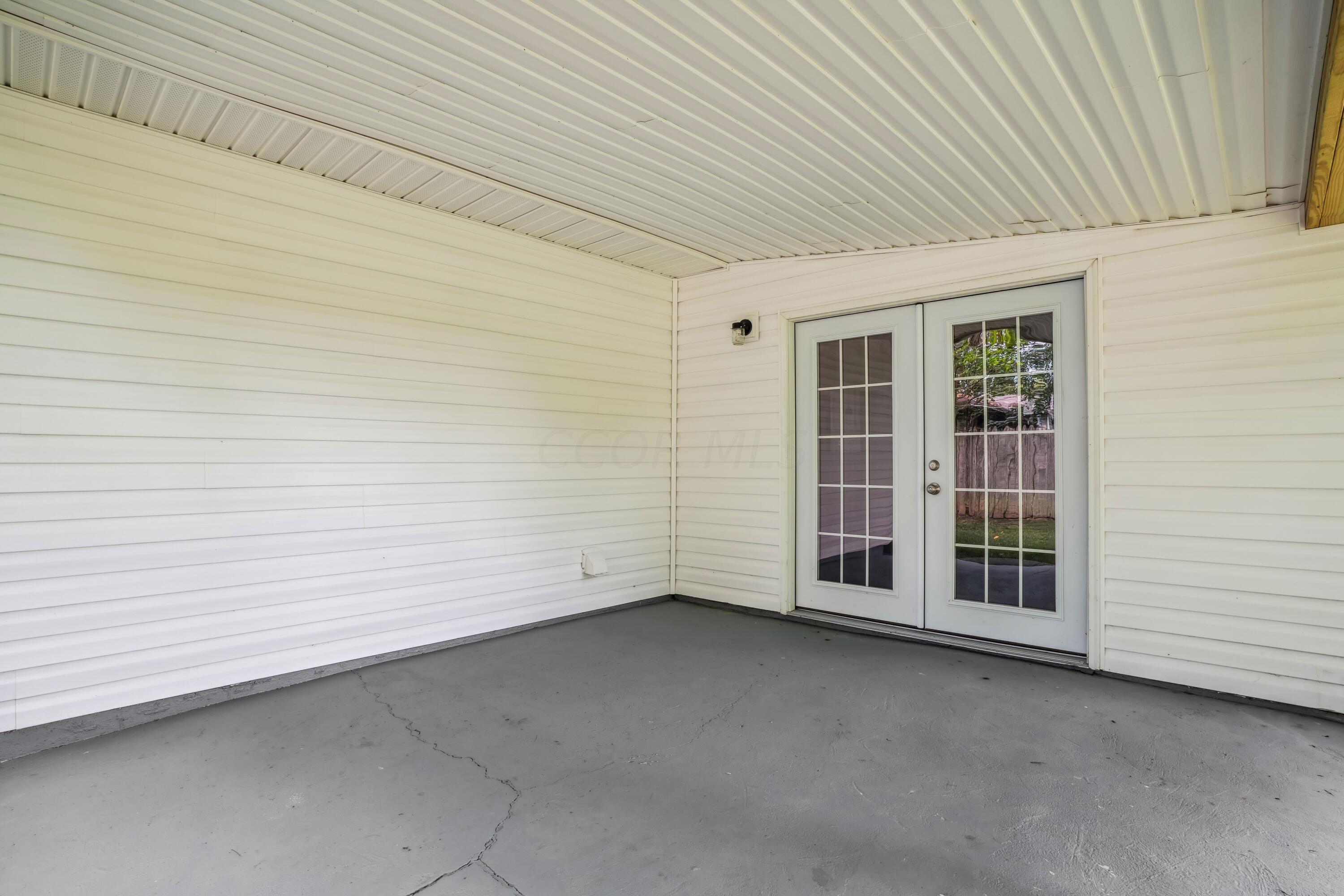 6705 Johnson Road Galloway, OH 43119 - Photo 26 of 30 Covered private back patio, perfect for relaxing and enjoying the views of the backyard!