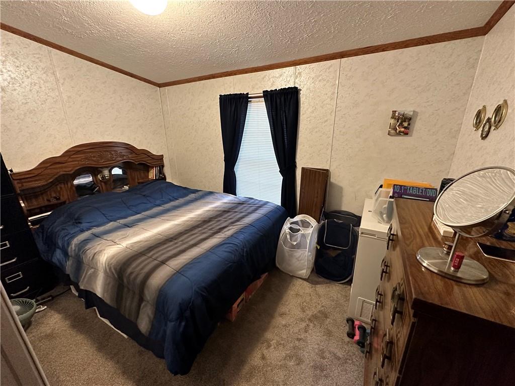 133 Ash Street Rochester, PA 15074 - Photo 10 of 13 a bedroom with a bed and wooden floor