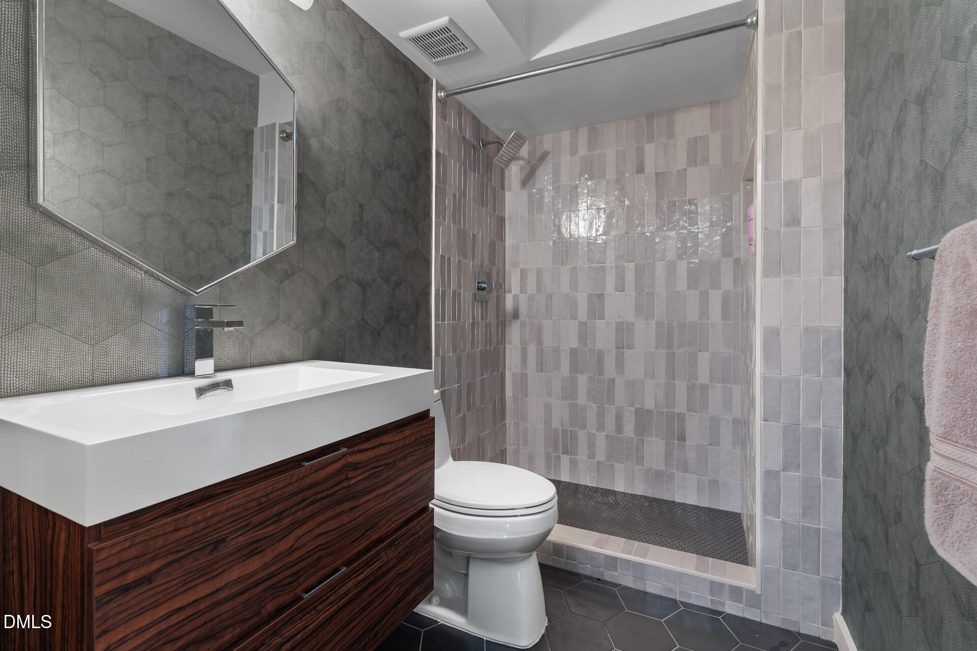 5208 Saddle Court Raleigh, NC 27609 - Photo 33 of 43 a bathroom with a sink a toilet and shower