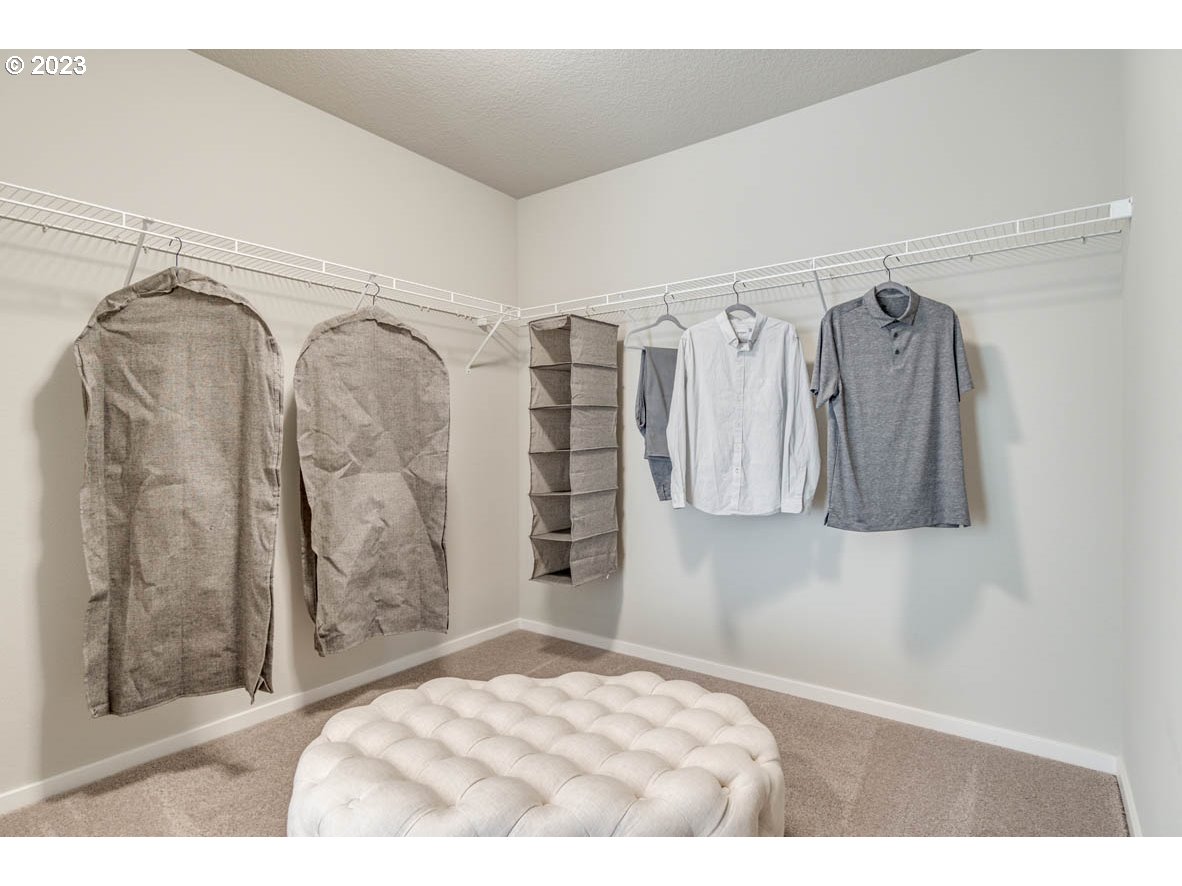 2632 26th Loop Springfield, OR 97477 - Photo 12 of 12 a bedroom with a walk in closet and closet