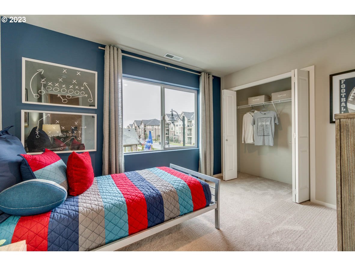 2632 26th Loop Springfield, OR 97477 - Photo 8 of 12 a bedroom with a large bed and a window