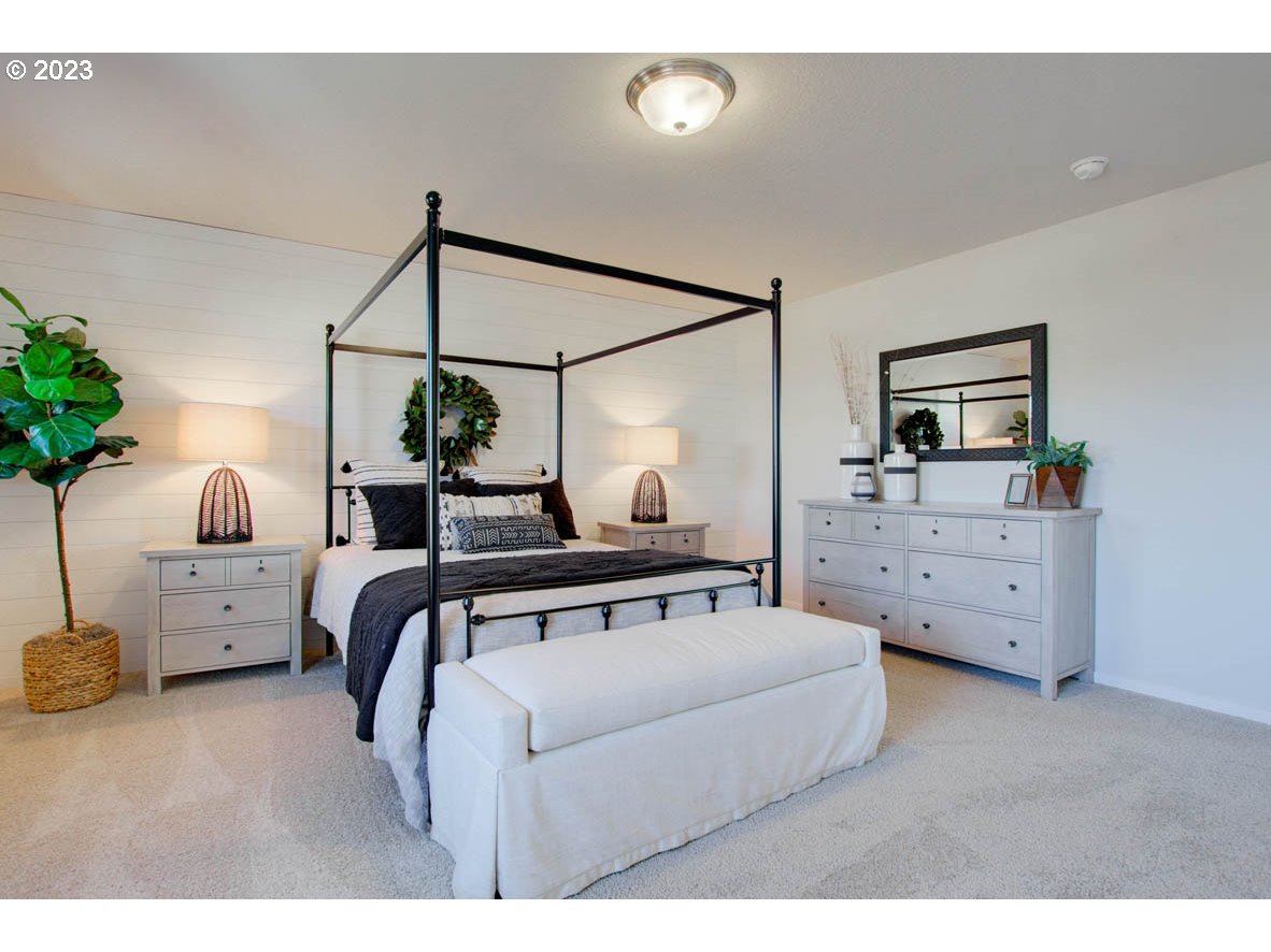 2632 26th Loop Springfield, OR 97477 - Photo 10 of 12 a living room with furniture and potted plants