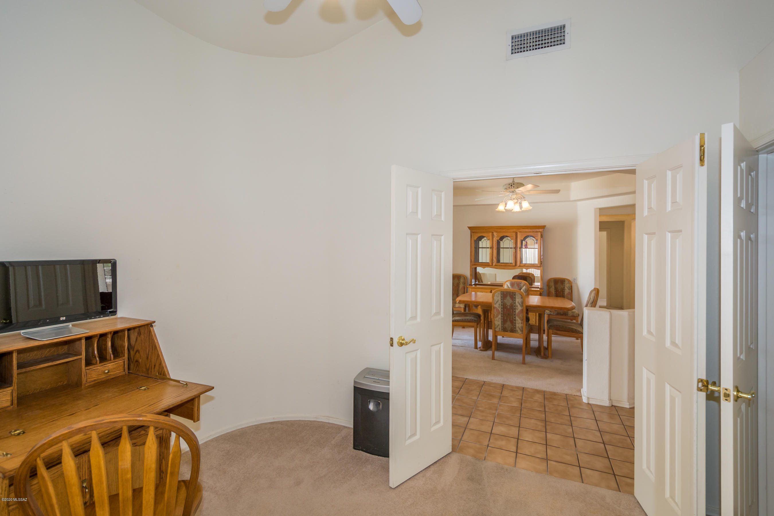 11341 Silver Pheasant Loop Oro Valley, AZ 85737 - Photo 30 of 41 a view of a livingroom with dining room and hallway
