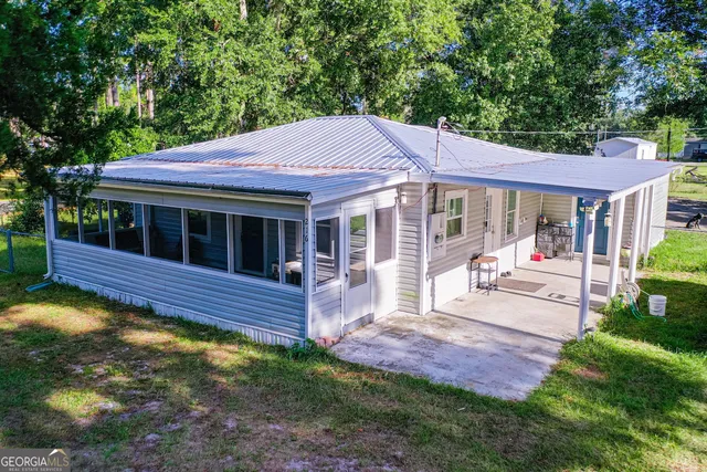 a view of house with outdoor entertaining spaces