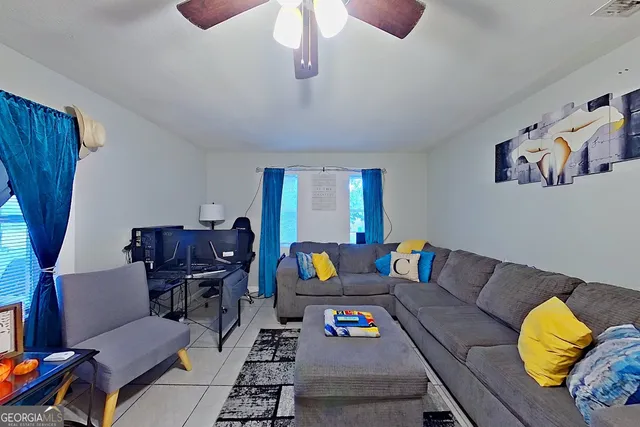 a living room with furniture and a window