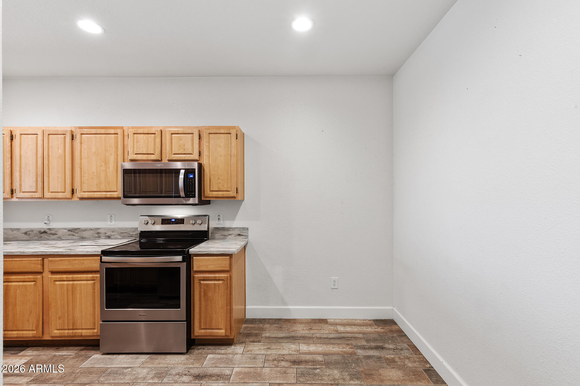 7101 West Beardsley Road, Unit 1303 Glendale, AZ 85308 - Photo 13 of 53 a stove top oven sitting inside of a kitchen