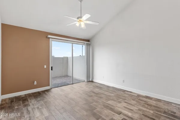 a view of an empty room with a window
