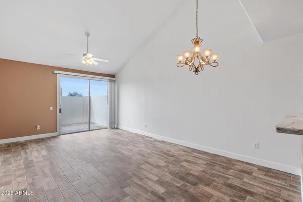a view of a chandelier and wooden floor