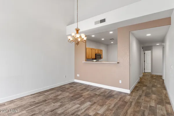 a view of a chandelier fan and entryway