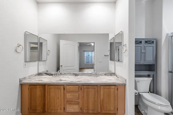 a bathroom with a shower and toilet