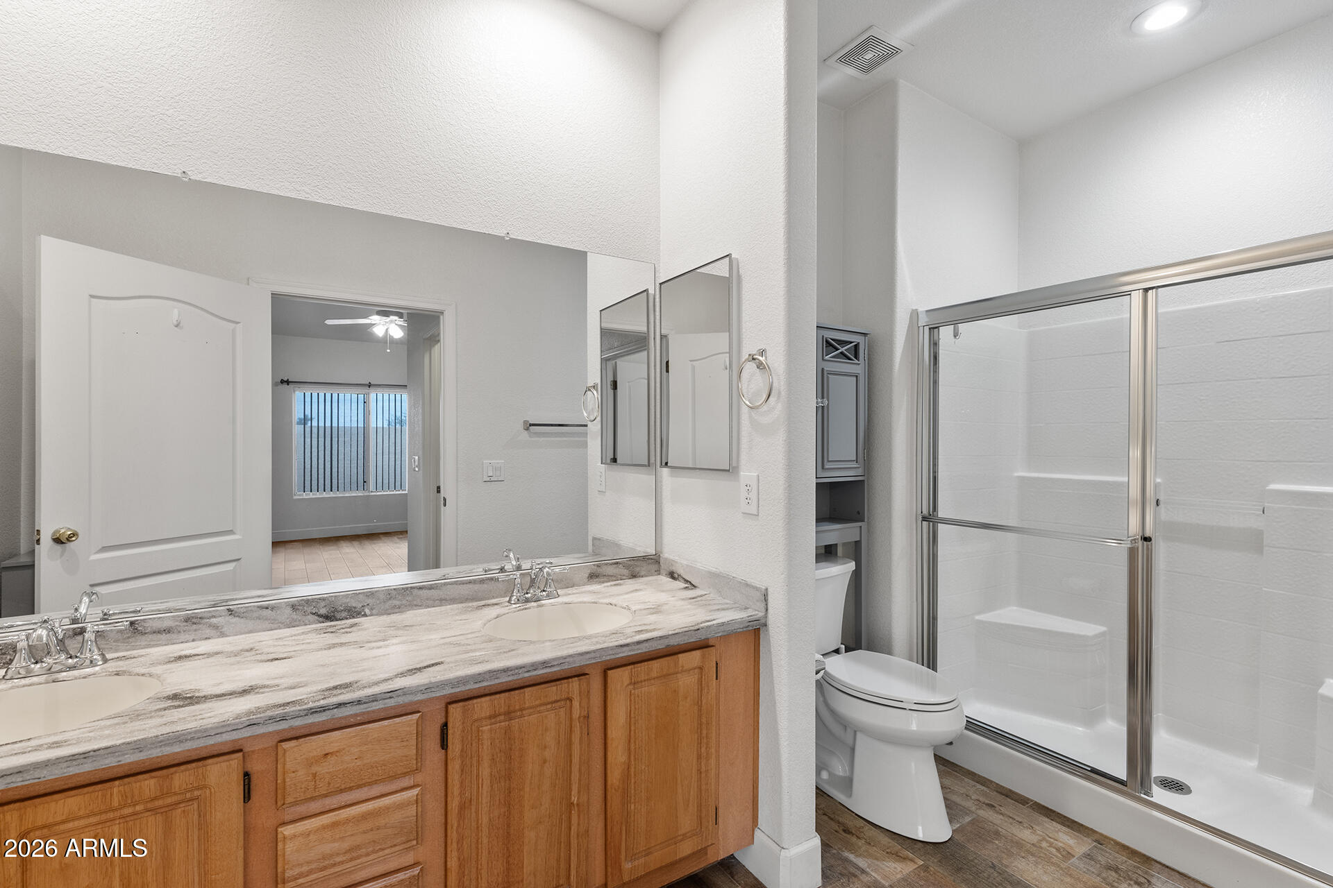 7101 West Beardsley Road, Unit 1303 Glendale, AZ 85308 - Photo 29 of 53 a bathroom with a granite countertop sink toilet and shower