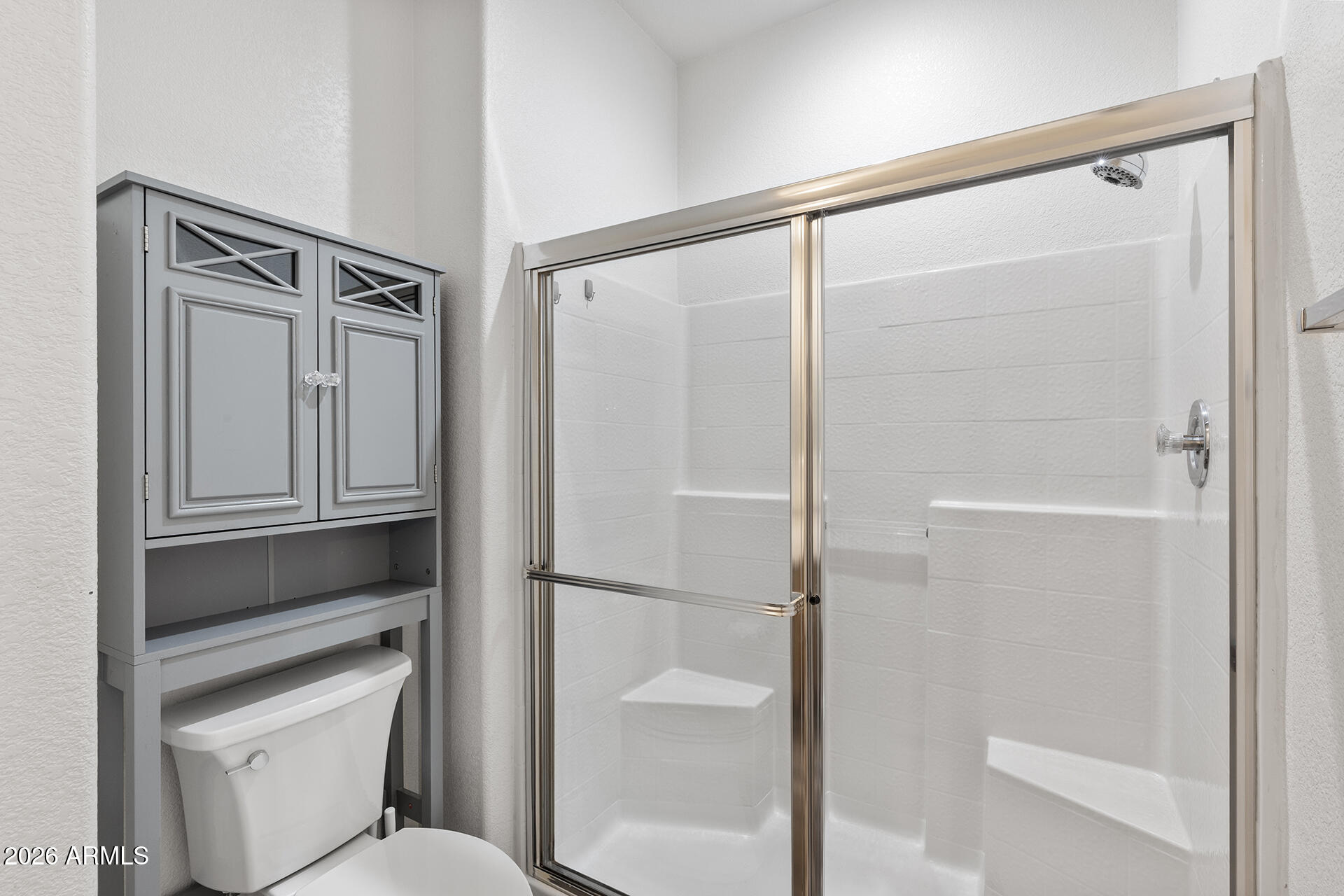 7101 West Beardsley Road, Unit 1303 Glendale, AZ 85308 - Photo 30 of 53 a bathroom with a shower and toilet