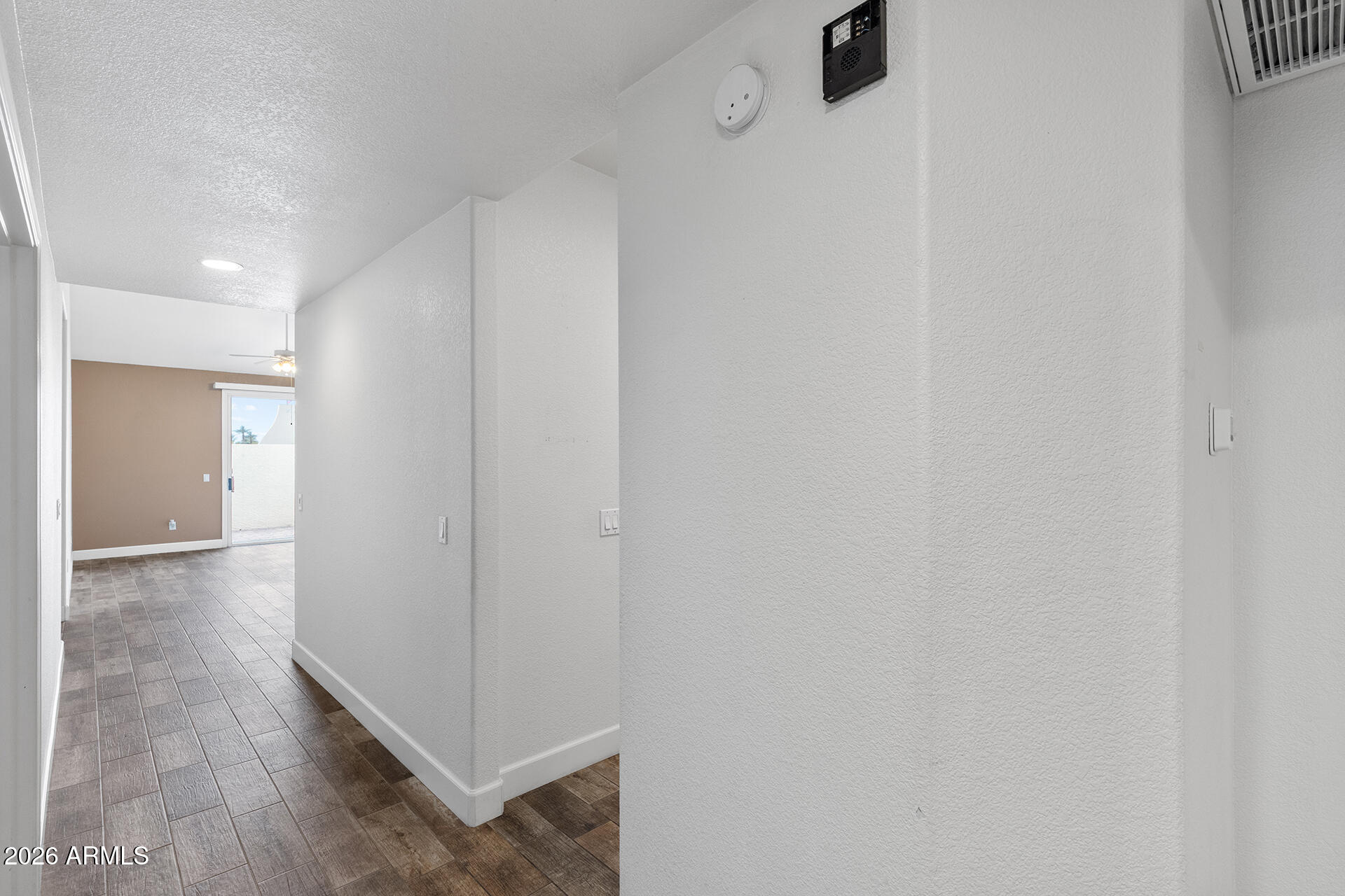 7101 West Beardsley Road, Unit 1303 Glendale, AZ 85308 - Photo 31 of 53 a view of a hallway with wooden floor
