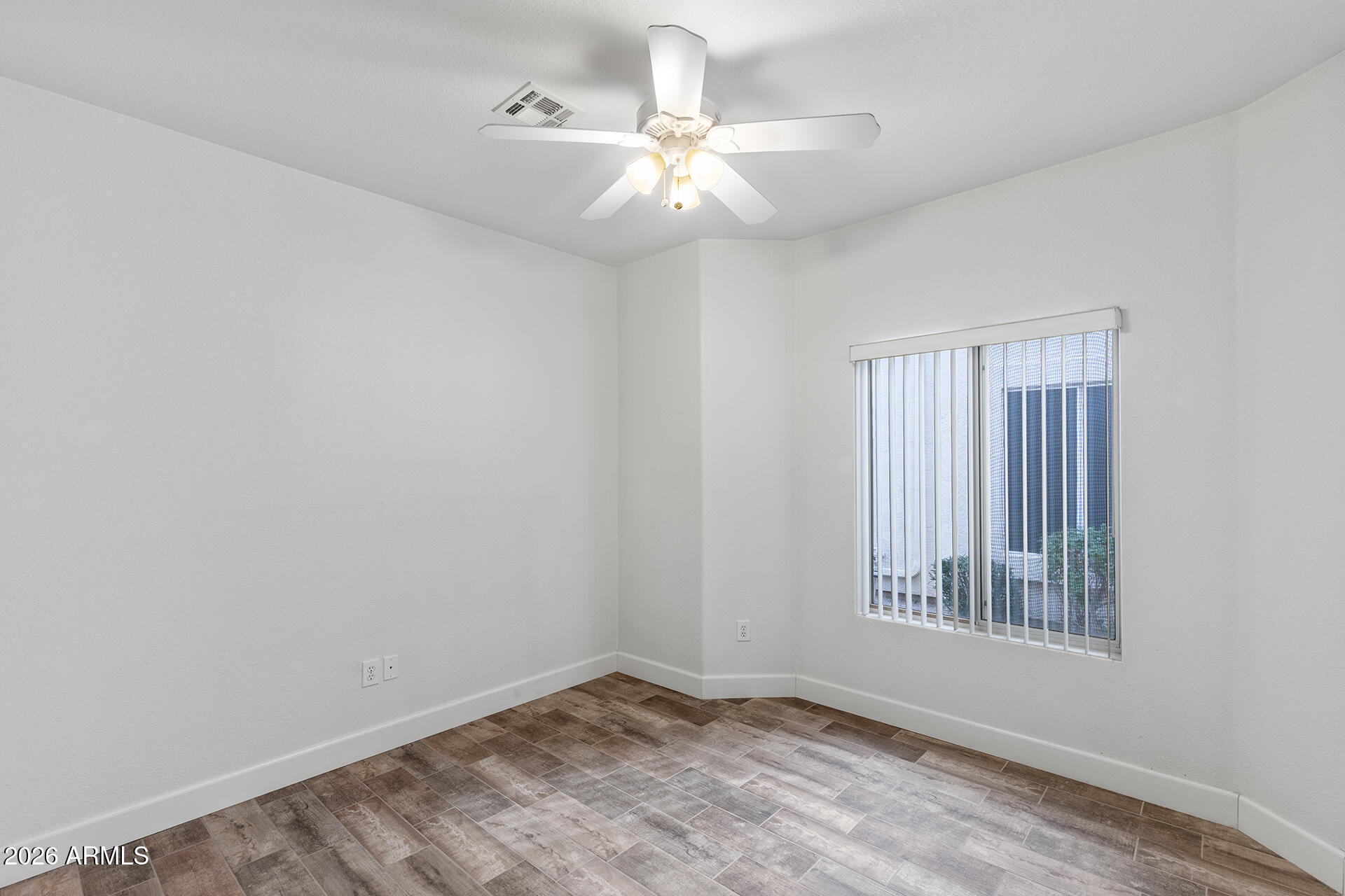 7101 West Beardsley Road, Unit 1303 Glendale, AZ 85308 - Photo 34 of 53 a view of an empty room with a window