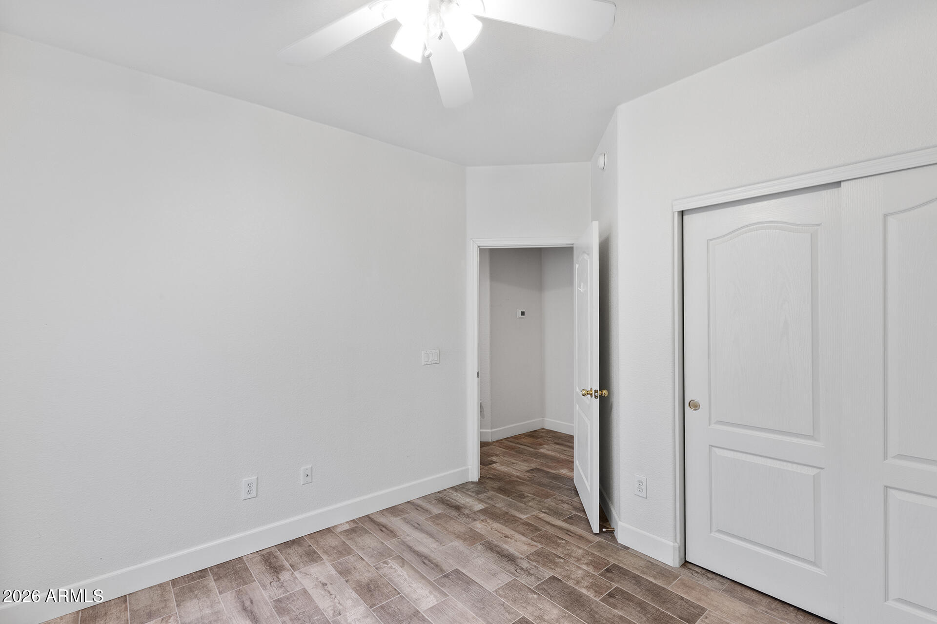 7101 West Beardsley Road, Unit 1303 Glendale, AZ 85308 - Photo 38 of 53 wooden floor in an empty room