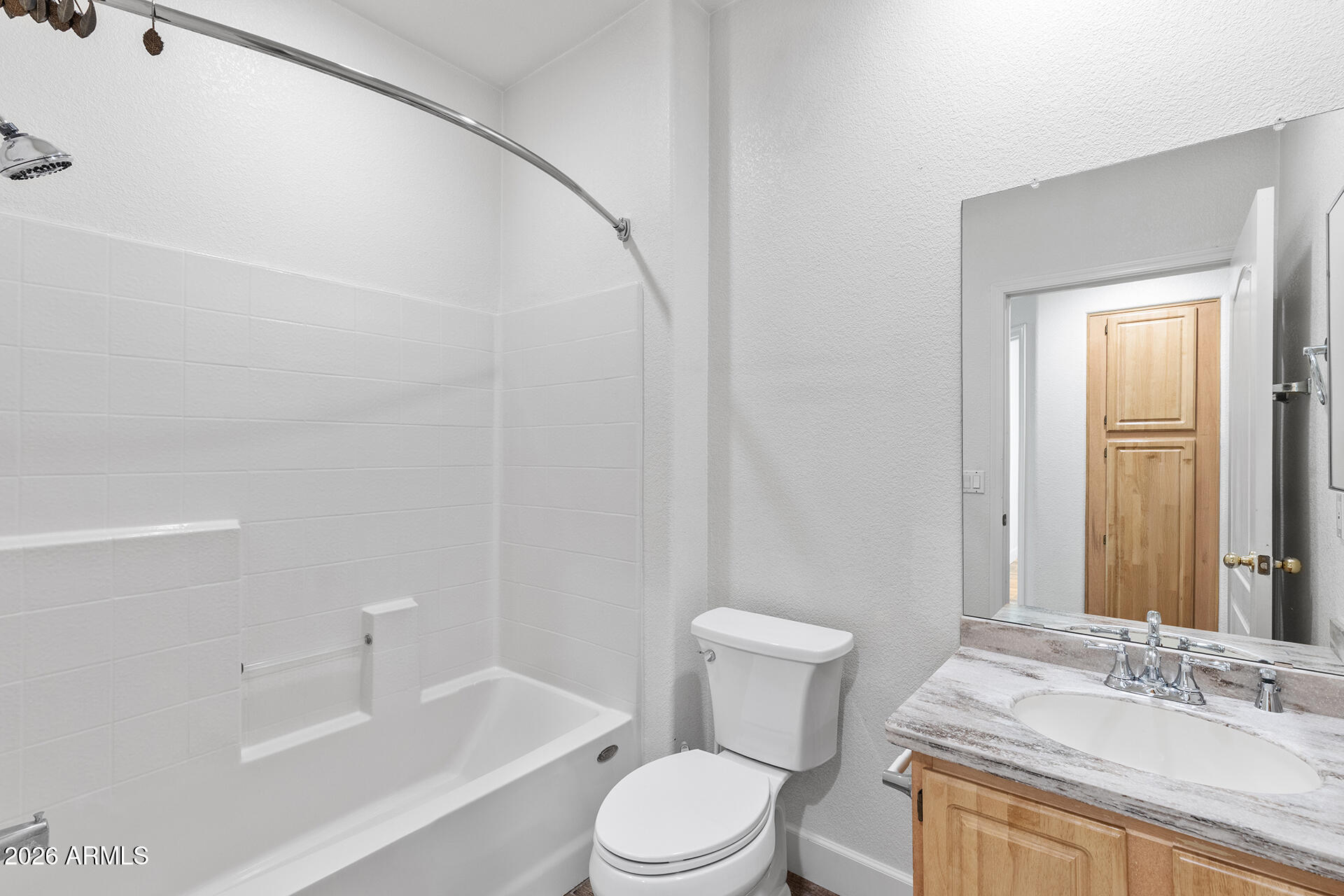 7101 West Beardsley Road, Unit 1303 Glendale, AZ 85308 - Photo 39 of 53 a bathroom with a sink a toilet and shower