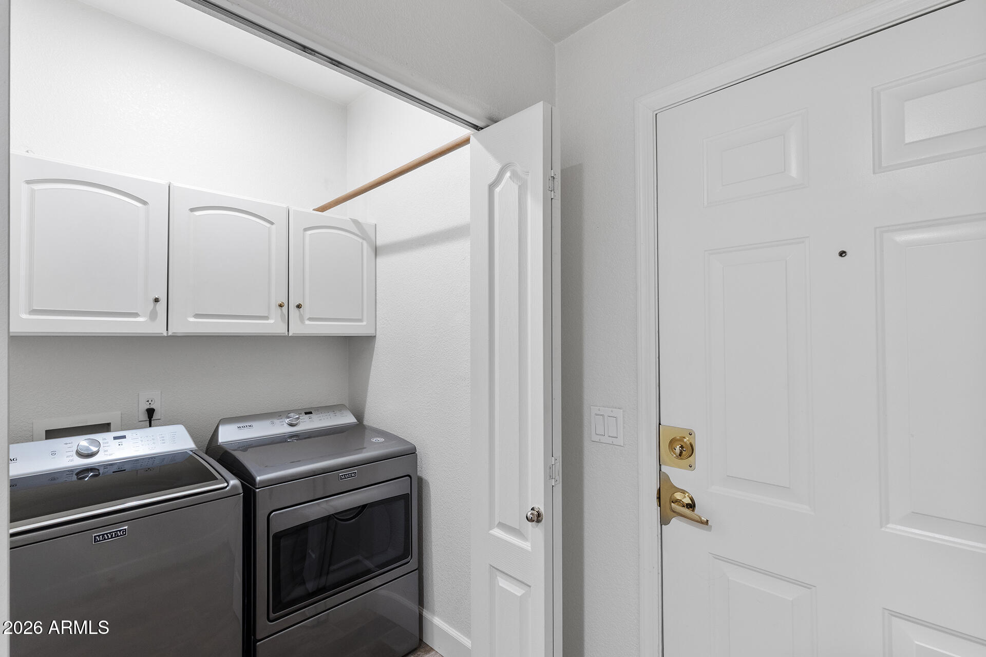 7101 West Beardsley Road, Unit 1303 Glendale, AZ 85308 - Photo 42 of 53 a view of storage and utility room with washer and dryer