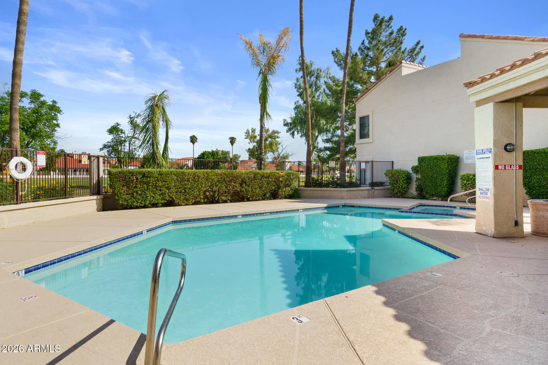 7101 West Beardsley Road, Unit 1303 Glendale, AZ 85308 - Photo 50 of 53 a view of a swimming pool with a lounge chairs