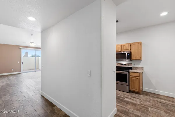 a kitchen with stainless steel appliances granite countertop a stove microwave and sink