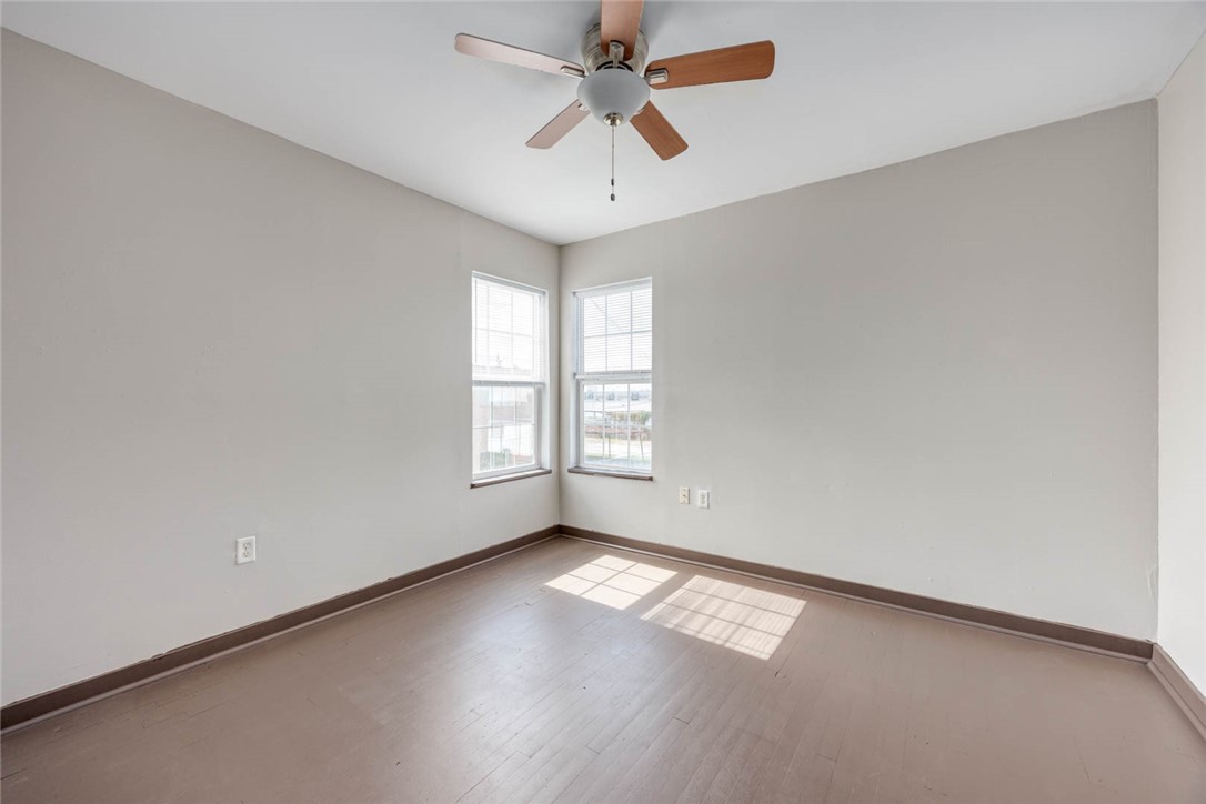 2437 Nemec Street Corpus Christi, TX 78415 - Photo 14 of 38 an empty room with windows and fan