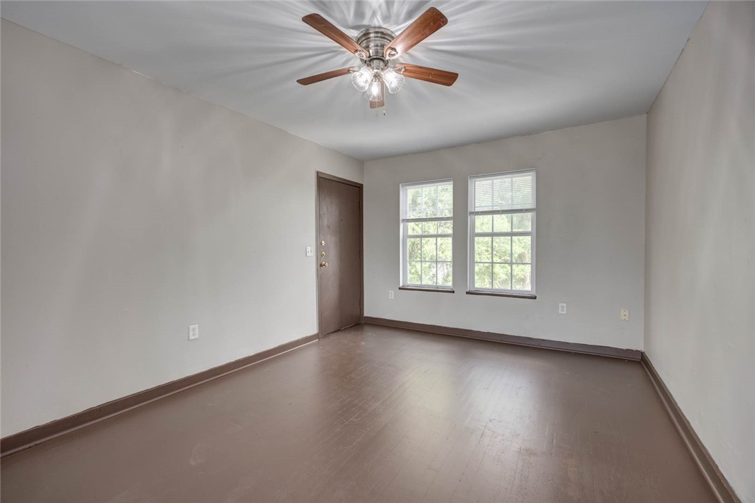 2437 Nemec Street Corpus Christi, TX 78415 - Photo 19 of 38 an empty room with wooden floor and windows