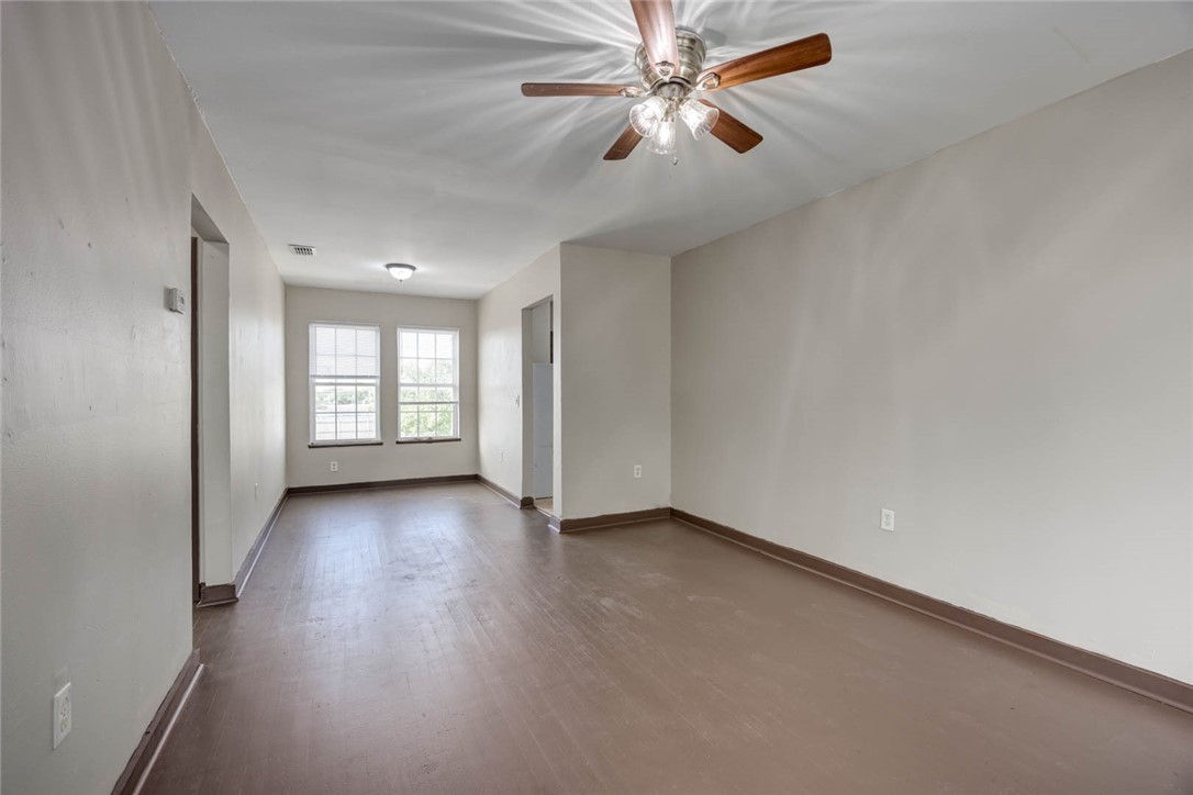 2437 Nemec Street Corpus Christi, TX 78415 - Photo 20 of 38 wooden floor in an empty room with a window