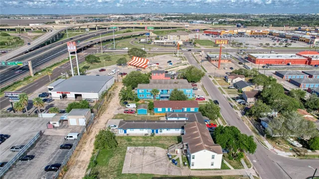 an aerial view of residential houses with outdoor space