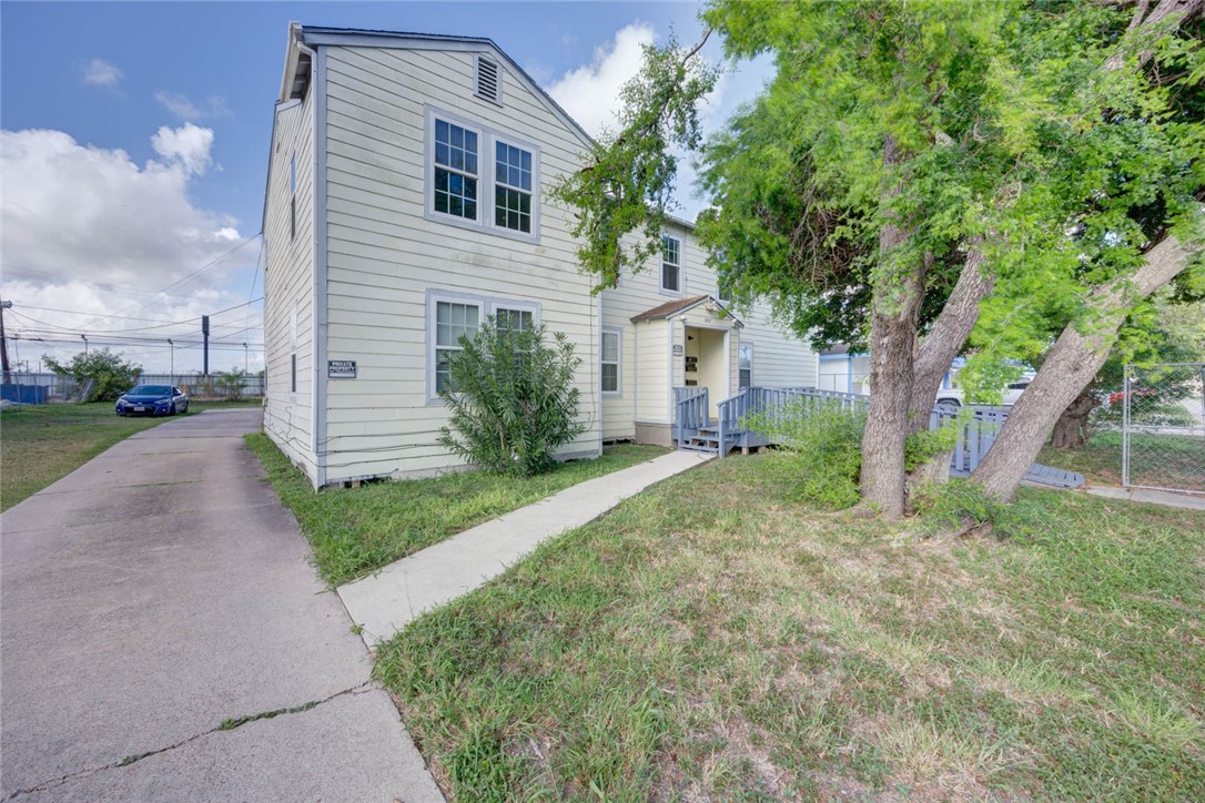 2437 Nemec Street Corpus Christi, TX 78415 - Photo 7 of 38 a view of a house with a yard and large tree