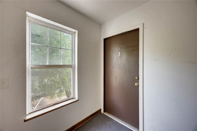 an empty room with window