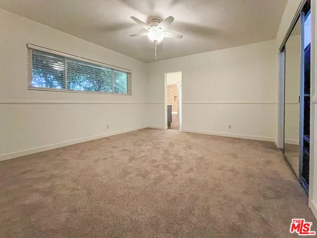 a view of empty room with windows