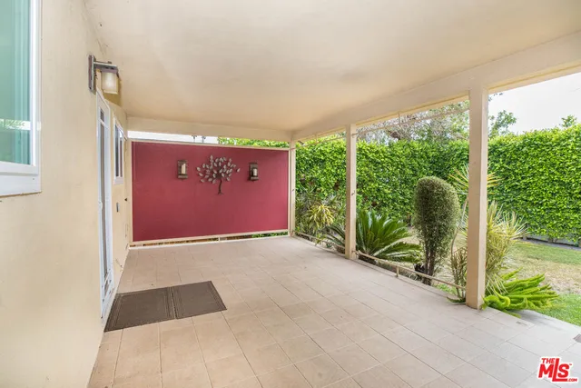 a view of an empty room with a large window