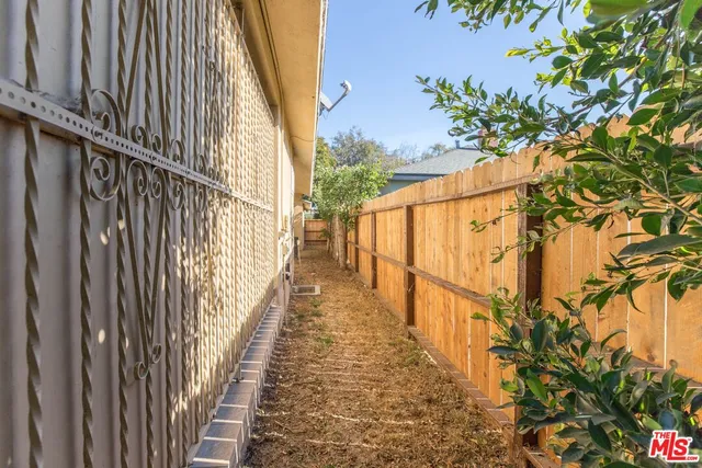 a view of entryway with wooden floor and fence