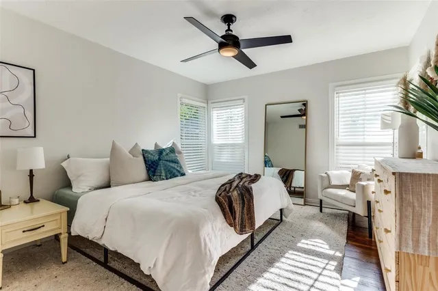 a bedroom with bed and a window