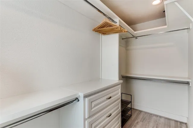 a view of storage and utility room with closet
