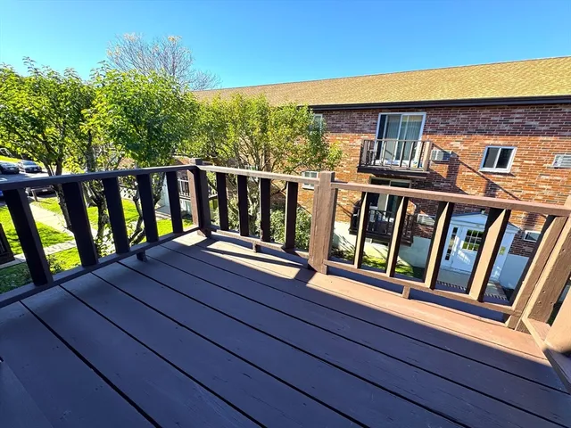 a balcony view with a large window