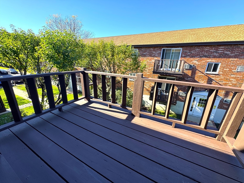 44 Westgate Road, Unit 5 Boston, MA 02467 - Photo 13 of 15 a balcony view with a large window