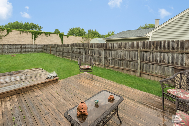 76 Fernwood Road Montgomery, IL 60538 - Photo 11 of 13 a view of a backyard with sitting area