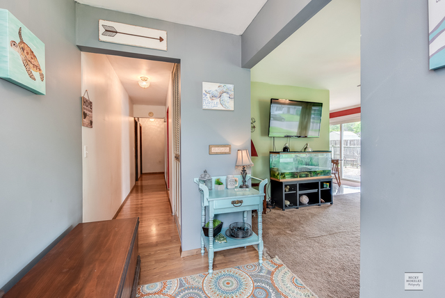 76 Fernwood Road Montgomery, IL 60538 - Photo 6 of 13 a living room with furniture and wooden floor