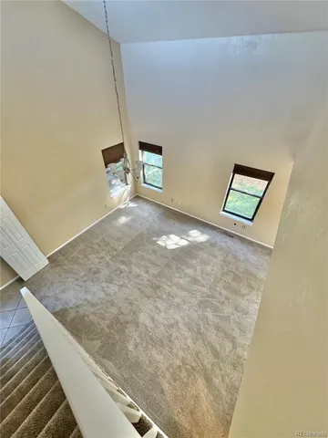 a view of a hallway with stairs
