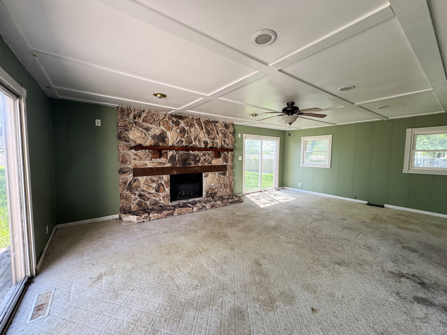 310 North 3rd Avenue Chenoa, IL 61726 - Photo 13 of 23 a view of empty room with fireplace and window