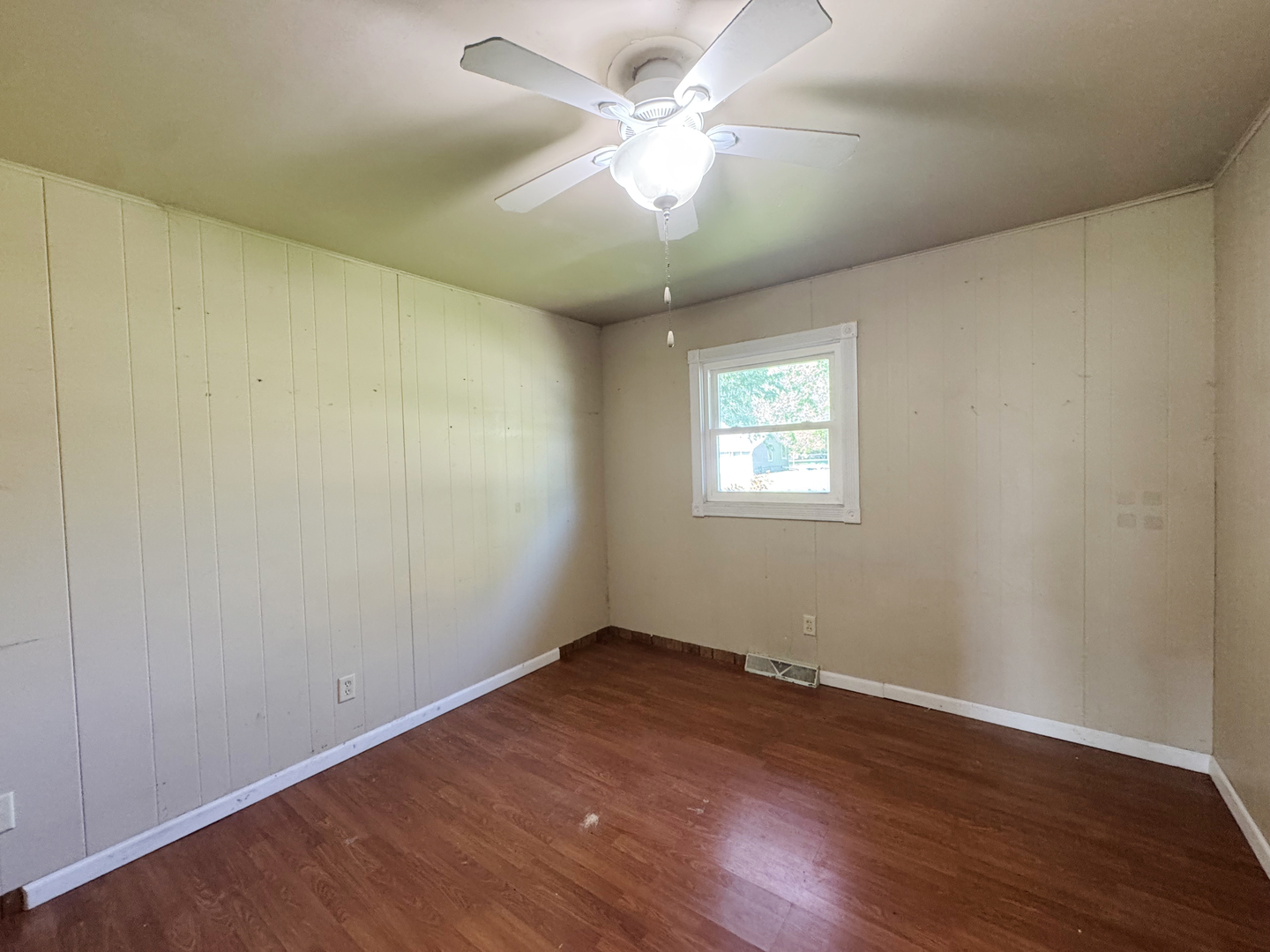 310 North 3rd Avenue Chenoa, IL 61726 - Photo 15 of 23 wooden floor in an empty room with a window