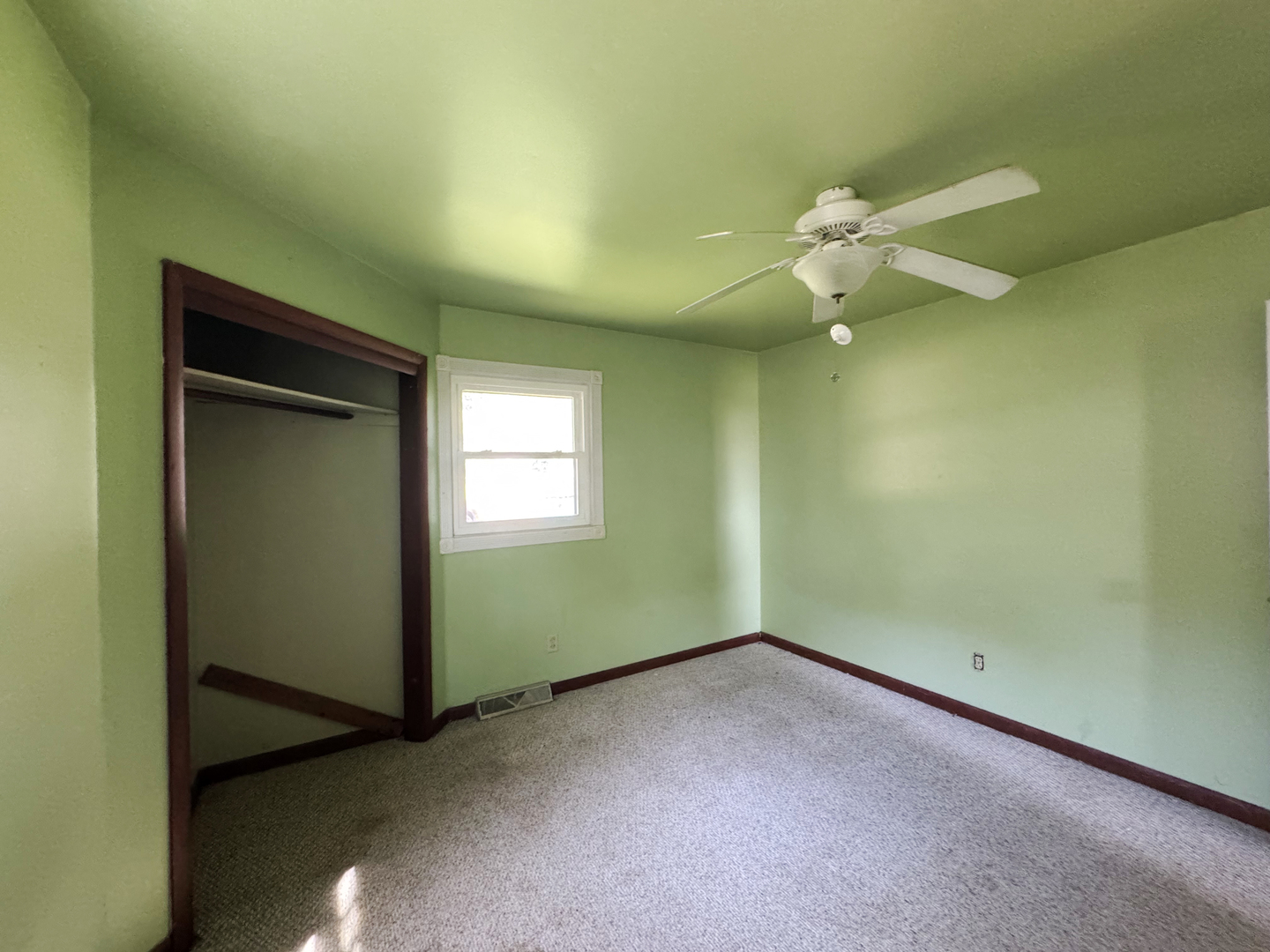 310 North 3rd Avenue Chenoa, IL 61726 - Photo 19 of 23 an empty room with a fan and a window