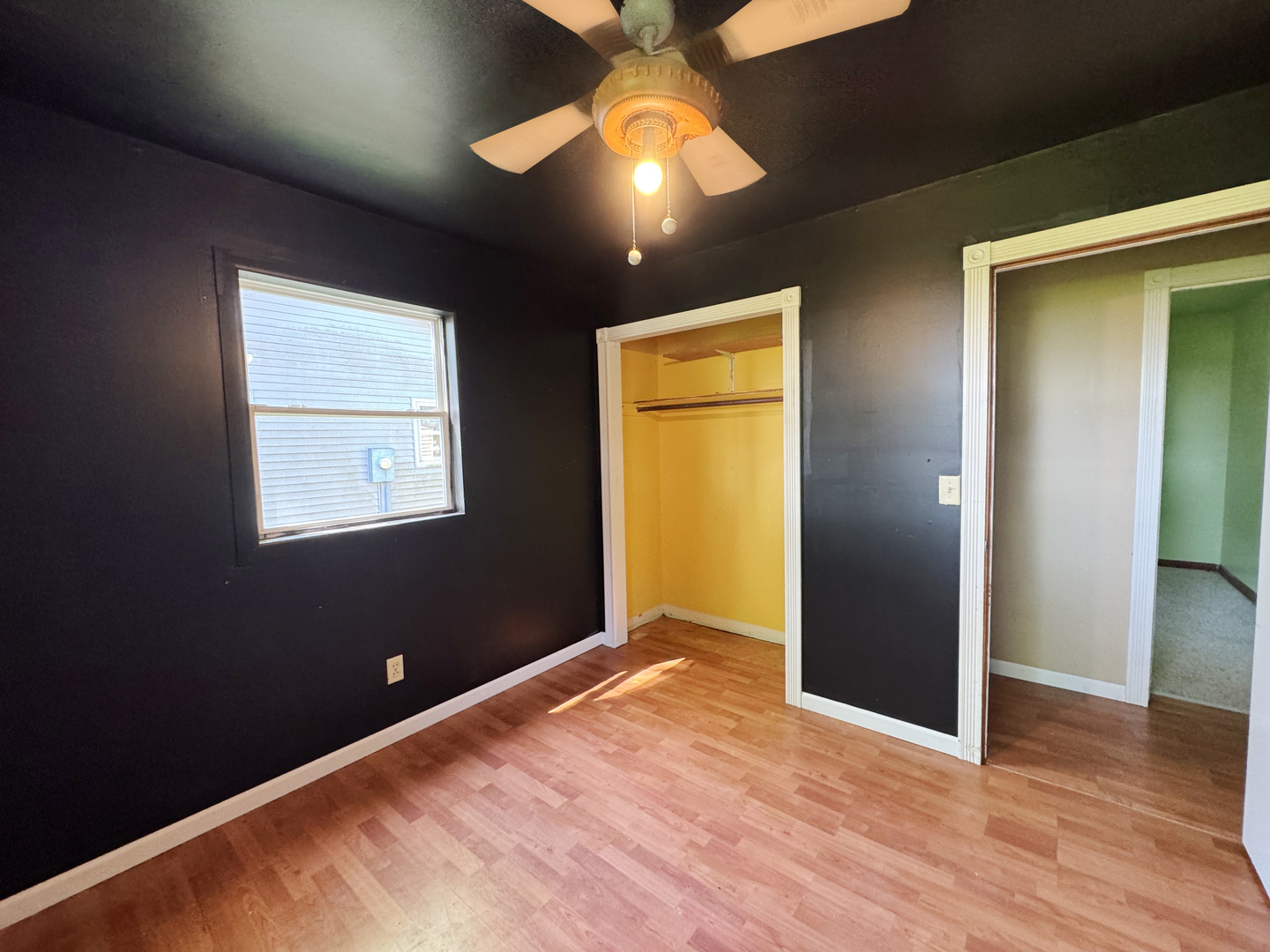 310 North 3rd Avenue Chenoa, IL 61726 - Photo 21 of 23 a view of an empty room with wooden floor and a window