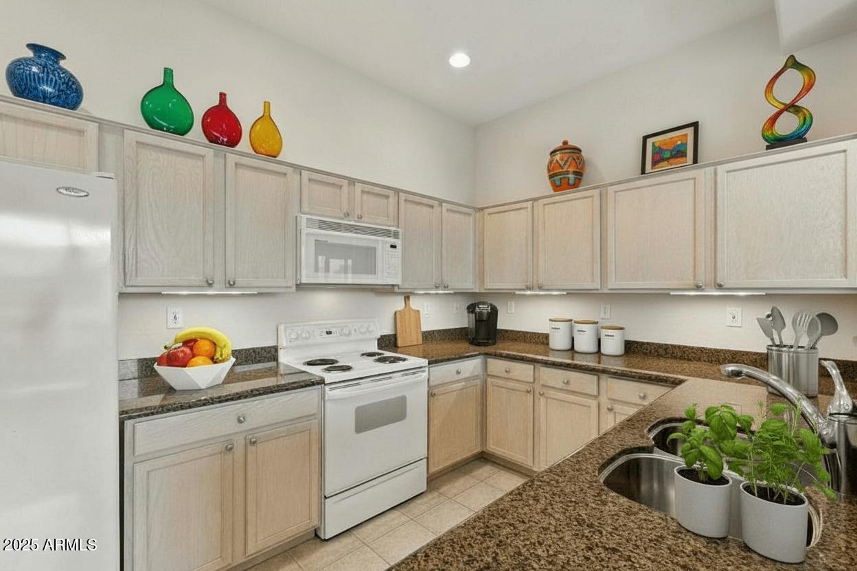 16420 North Thompson Peak Parkway, Unit 2031 Scottsdale, AZ 85260 - Photo 11 of 30 a kitchen with a sink cabinets and window